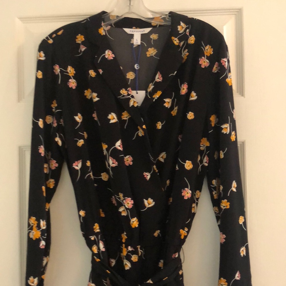 Black floral jumpsuit. Size L. NWT!